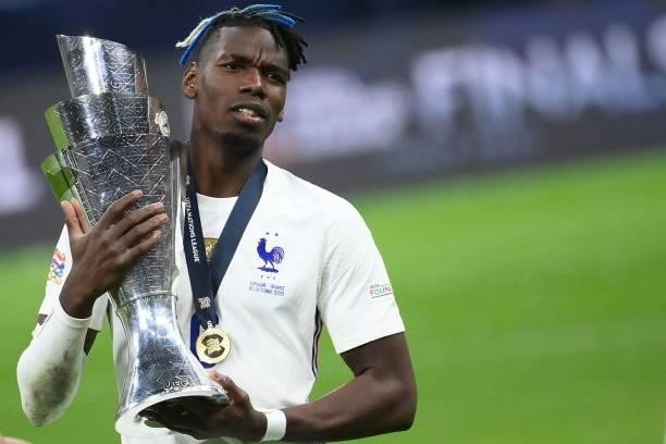France's midfielder Paul Pogba celebrates with the trophy at the end of the Nations League final football match between Spain and France at San Siro...