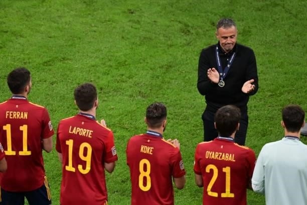 Spain's coach Luis Enrique applauds his players at the end of the Nations League final football match between Spain and France at San Siro stadium in...