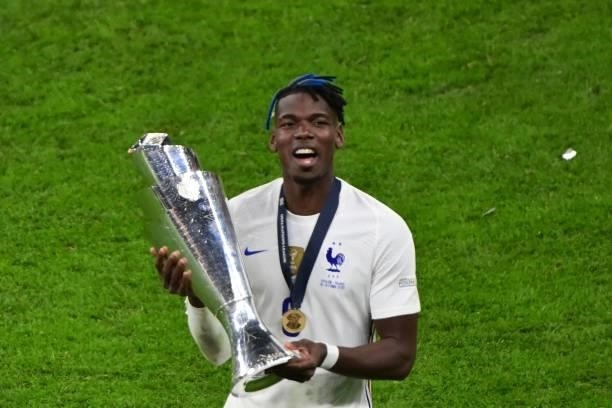 France's midfielder Paul Pogba celebrates with the trophy at the end of the Nations League final football match between Spain and France at San Siro...
