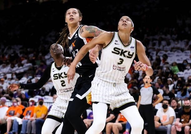 Kahleah Copper of the Chicago Sky, Brittney Griner of the Phoenix Mercury and Candace Parker of the Chicago Sky battle for a rebound in the second...