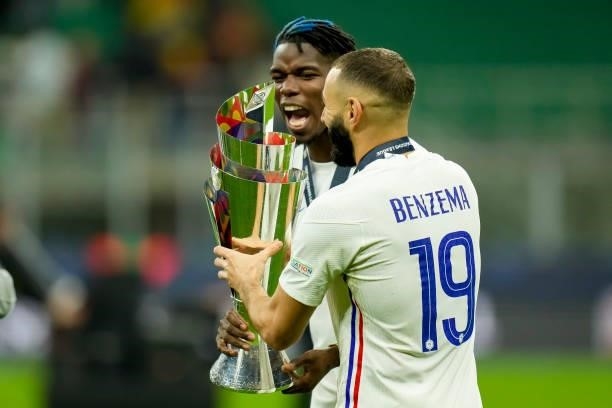 Paul Pogba of France and Karim Benzema of France celebrate with the trophy after winning the UEFA Nations League Final match between the Spain and...