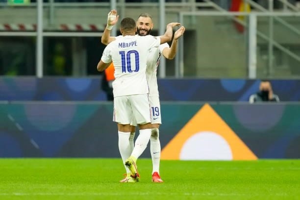 Kylian Mbappe of France and Karim Benzema of France celebrate after winning the UEFA Nations League Final match between the Spain and France at San...