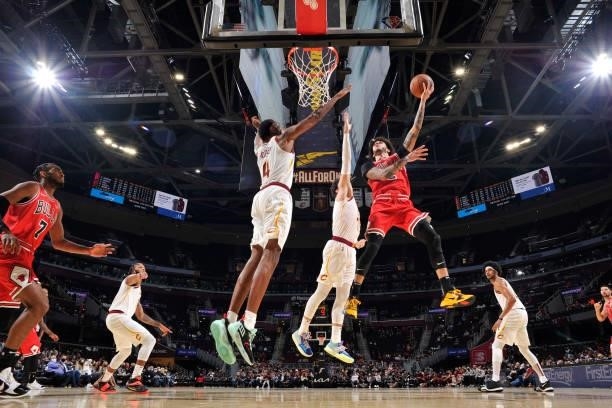 Lonzo Ball of the Chicago Bulls drives to the basket during a preseason game against the Cleveland Cavaliers on October 10, 2021 at Rocket Mortgage...