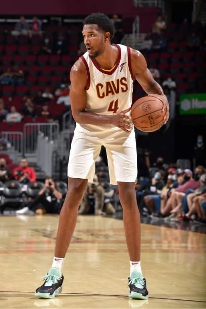 Evan Mobley of the Cleveland Cavaliers handles the ball during a preseason game against the Chicago Bulls on October 10, 2021 at Rocket Mortgage...