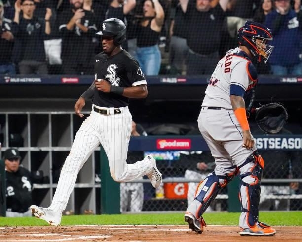Tim Anderson of the Chicago White Sox crosses the plate after an Eloy Jimenez single in the first inning during Game 3 of the ALDS between the...