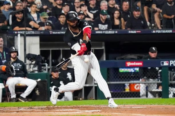 Eloy Jimenez of the Chicago White Sox hits an RBI single in the first inning during Game 3 of the ALDS between the Houston Astros and the Chicago...