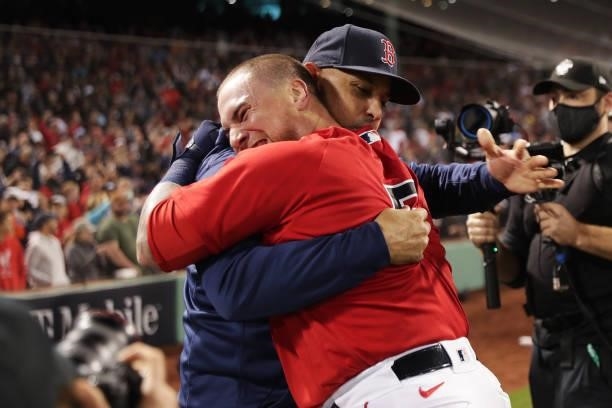 Christian Vázquez of the Boston Red Sox celebrates with manager Alex Cora after hitting a walk-off home run in the 13th inning during Game 3 of the...
