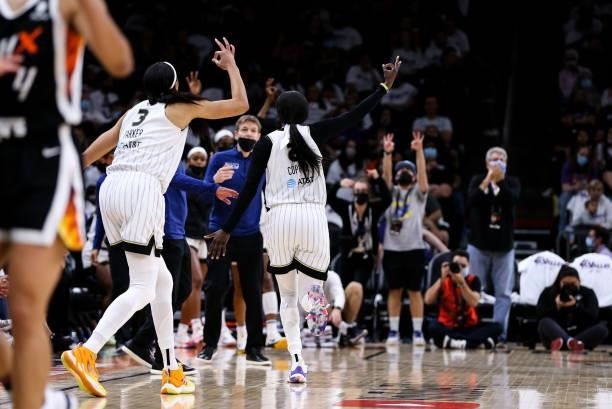 Kahleah Copper and Candace Parker of the Chicago Sky react to a 3 pointer in the second half during the game against the Phoenix Mercury at Footprint...