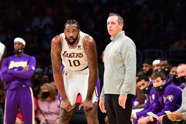 Head Coach Frank Vogel and DeAndre Jordan of the Los Angeles Lakers look on during a preseason game against the Phoenix Suns on October 10, 2021 at...