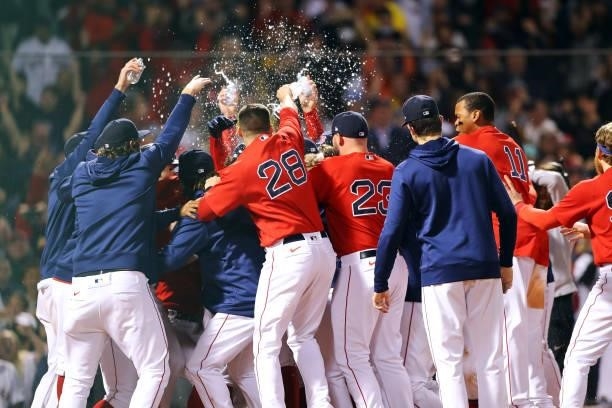 The Red Sox celebrate a 6-4 win over the Rays in 13 innings in Game 3 of the ALDS between the Tampa Bay Rays and the Boston Red Sox at Fenway Park on...