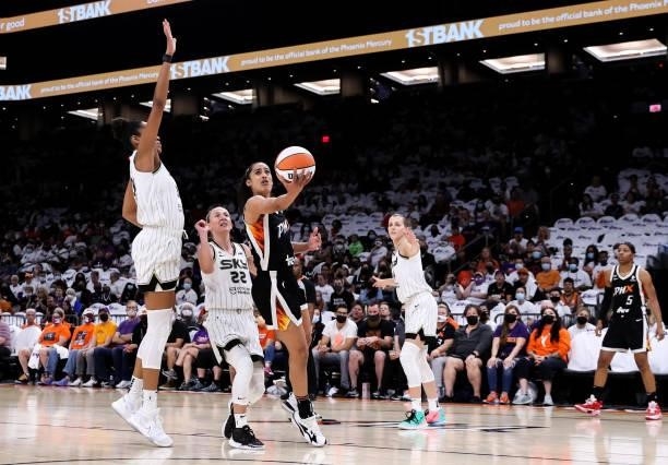 Skylar Diggins-Smith of the Phoenix Mercury drives to the basket past Courtney Vandersloot of the Chicago Sky in the first half at Footprint Center...