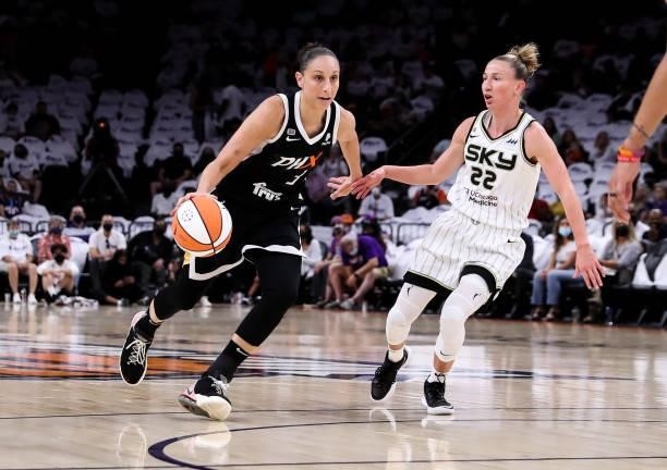 Diana Taurasi of the Phoenix Mercury drives past Courtney Vandersloot of the Chicago Sky in the first half at Footprint Center on October 10, 2021 in...