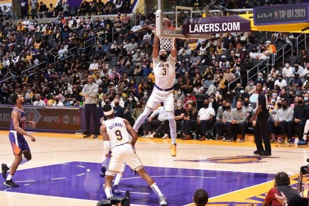 Anthony Davis of the Los Angeles Lakers dunks the ball during a preseason game against the Phoenix Suns on October 10, 2021 at STAPLES Center in Los...