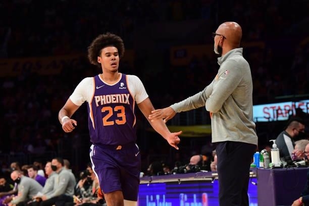 Cameron Johnson of the Phoenix Suns high-fives coach Head Coach Monty Williams during a preseason game against the Los Angeles Lakers on October 10,...