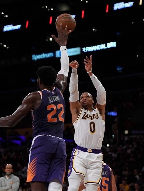 Russell Westbrook of the Los Angeles Lakers shoots over Deandre Ayton of the Phoenix Suns in the first half of a preseason game at Staples Center on...