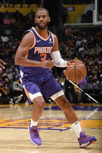 Chris Paul of the Phoenix Suns dribbles the ball during a preseason game against the Los Angeles Lakers on October 10, 2021 at STAPLES Center in Los...