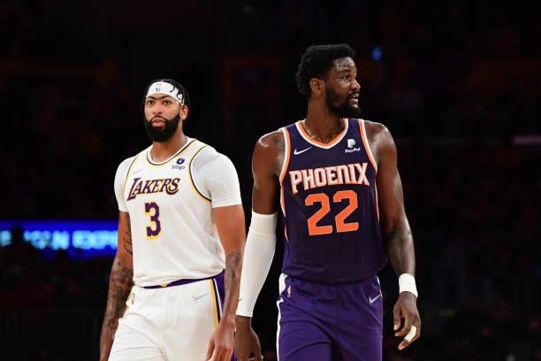 Anthony Davis of the Los Angeles Lakers and Deandre Ayton of the Phoenix Suns look on during a preseason game on October 10, 2021 at STAPLES Center...