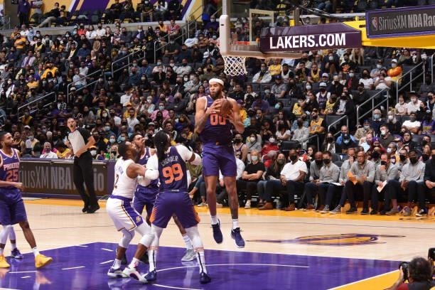 JaVale McGee of the Phoenix Suns catches the rebound during a preseason game against the Los Angeles Lakers on October 10, 2021 at STAPLES Center in...