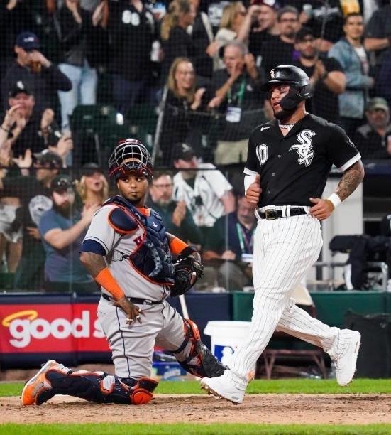 Yoan Moncada of the Chicago White Sox scores after an Andrew Vaughn double in the eight inning during Game 3 of the ALDS between the Houston Astros...