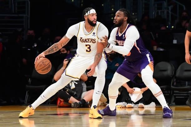 Jae Crowder of the Phoenix Suns plays defense on Anthony Davis of the Los Angeles Lakers during a preseason game on October 10, 2021 at STAPLES...