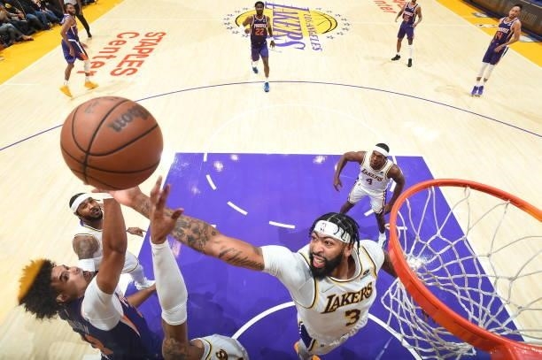 Anthony Davis of the Los Angeles Lakers catches the rebound during a preseason game against the Phoenix Suns on October 10, 2021 at STAPLES Center in...