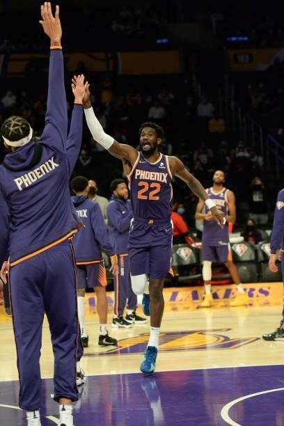 Deandre Ayton of the Phoenix Suns high fives before a preseason game against the Los Angeles Lakers on October 10, 2021 at STAPLES Center in Los...