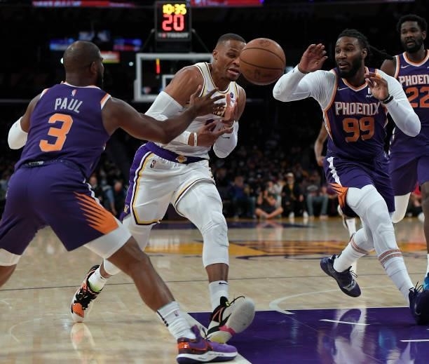 Russell Westbrook of the Los Angeles Lakers loses control of the ball against Chris Paul of the Phoenix Suns in the first half of a preseason game at...