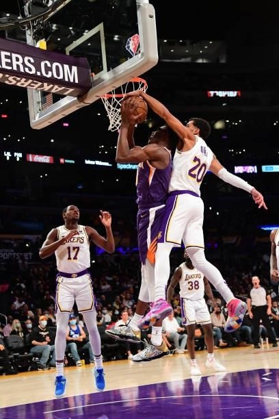 Trevelin Queen of the Los Angeles Lakers blocks a shot by Jalen Smith of the Phoenix Suns on October 10, 2021 at STAPLES Center in Los Angeles,...