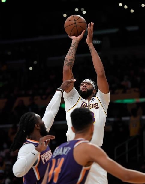 Anthony Davis of the Los Angeles Lakers shoots over Jae Crowder of the Phoenix Suns during the first half of preseason game against Phoenix Suns at...