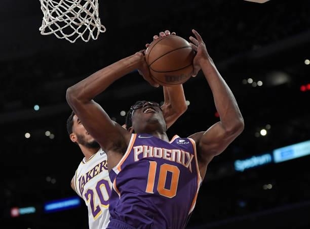 Jalen Smith of the Phoenix Suns gets the ball knocked out of his hands by Trevelin Queen of the Los Angeles Lakers during the second half of a...