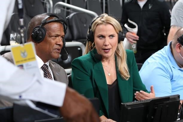 Announcers, Marques Johnson and Lisa Byington discuss and look on during a preseason game between the Oklahoma City Thunder and the Milwaukee Bucks...