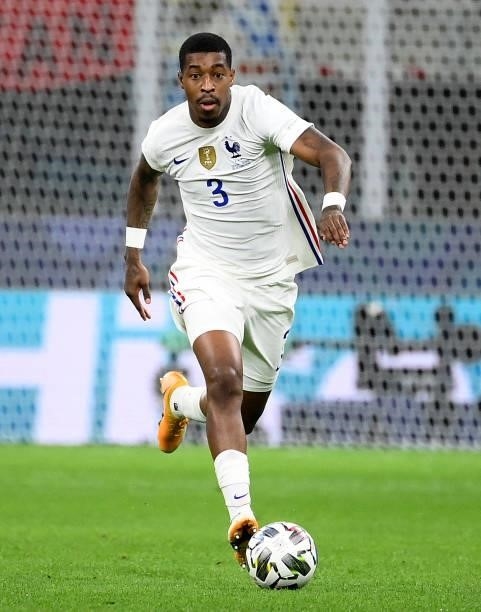 France's defender Presnel Kimpembe runs with the ball during the Nations League final football match between Spain and France at San Siro stadium in...
