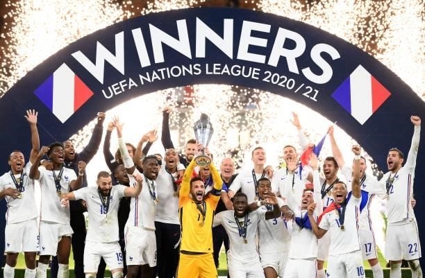 France's goalkeeper Hugo Lloris holds the trophy as he celebrates with teammates during the trophy ceremony at the end of the Nations League final...
