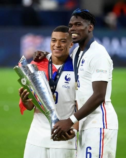 France's forward Kylian Mbappe and France's mdfielder Paul Pogba pose with the trophy at the end of the Nations League final football match between...