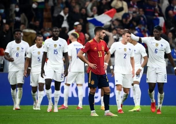 Spain's forward Ferran Torres reacts after a goal of France's forward Karim Benzema during the Nations League final football match between Spain and...