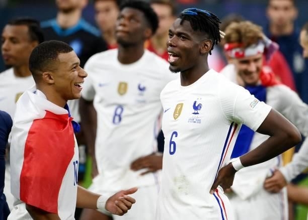 France's forward Kylian Mbappe jokes with France's mdfielder Paul Pogba at the end of the Nations League final football match between Spain and...
