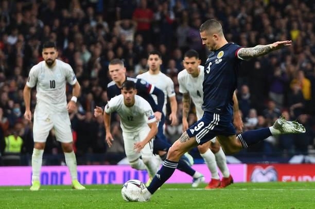 Scotland's striker Lyndon Dykes takes and misses a penalty during the FIFA World Cup Qatar 2022 Group F qualification football match between Scotland...