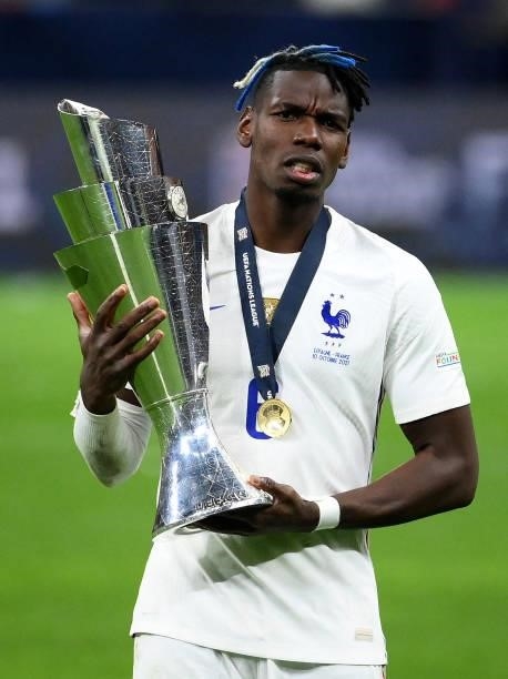 France's mdfielder Paul Pogba poses with the trophy at the end of the Nations League final football match between Spain and France at San Siro...
