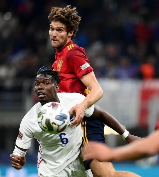 France's midfielder Paul Pogba fights for the ball with Spain's midfielder Marcos Alonso during the Nations League final football match between Spain...