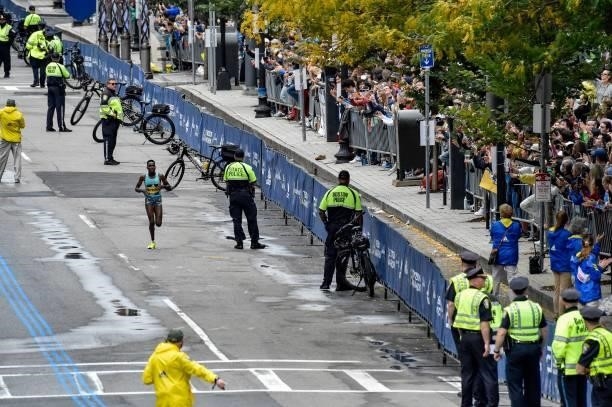 Diana Kipyogei of Kenya runs to the finish line to take first place in the professional women's division during the 125th Boston Marathon in Boston,...