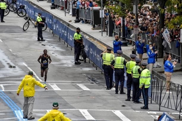 Benson Kipruto of Kenya runs to the finish line to take first place in the professional mens division during the 125th Boston Marathon in Boston,...