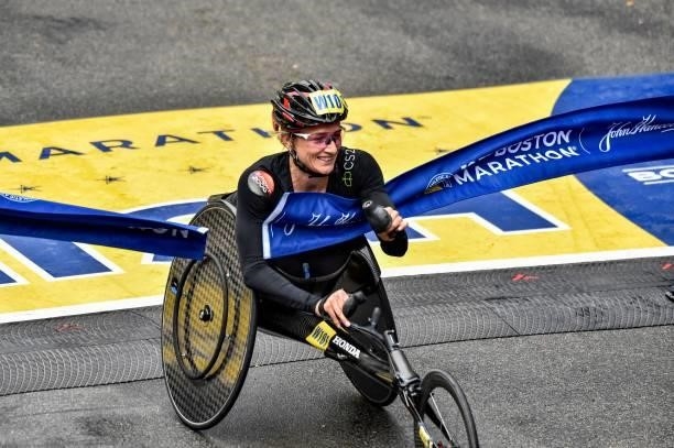 Switzerlands Manuela Schar crosses the finish line on Boylston Street and takes first place in the womens wheelchair division during the 125th Boston...