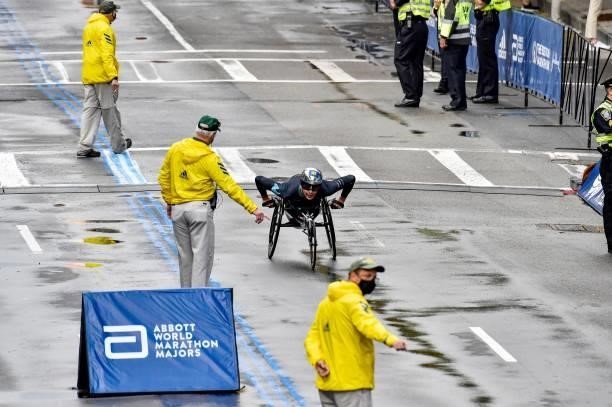 Switzerland's Marcel Hug makes his way to the finish line on Boylston Street and takes first place in the men's wheelchair division during the 125th...