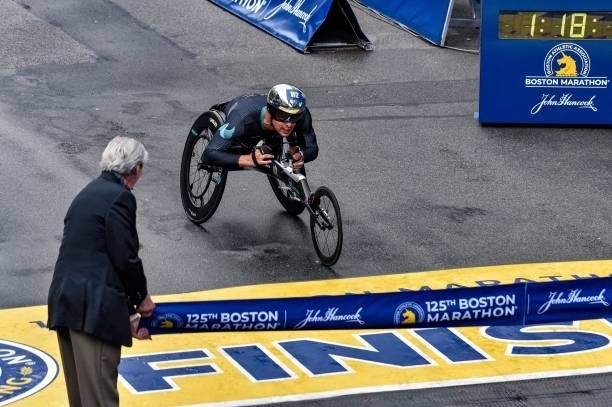 Switzerland's Marcel Hug crosses the finish line on Boylston Street and takes first place in the menÕs wheelchair division during the 125th Boston...