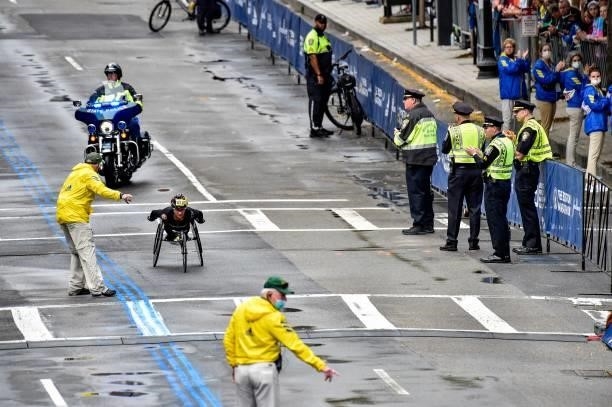 Switzerlands Manuela Schar races to the finish line on Boylston Street and takes first place in the womens wheelchair division during the 125th...