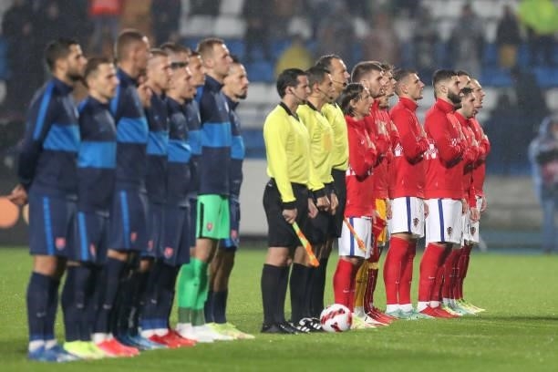 Team Croatia and Team Slovakia players line up for the national anthems prior the 2022 FIFA World Cup Group H Qualifier match between Croatia and...