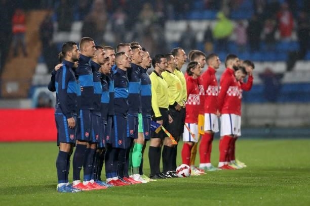 Team Croatia and Team Slovakia players line up for the national anthems prior the 2022 FIFA World Cup Group H Qualifier match between Croatia and...