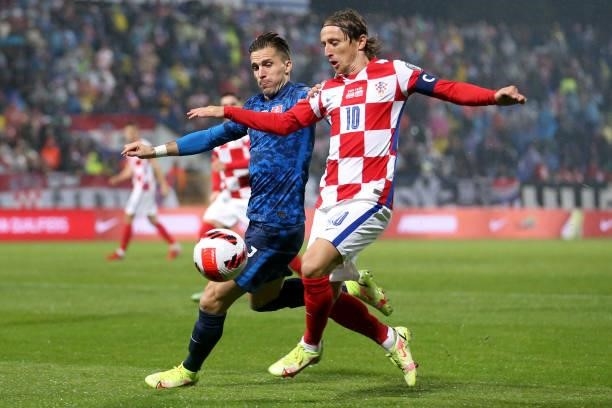 Luka Modric of Croatia and Peter Pekarik of Slovakia in action during the 2022 FIFA World Cup Group H Qualifier match between Croatia and Slovakia at...