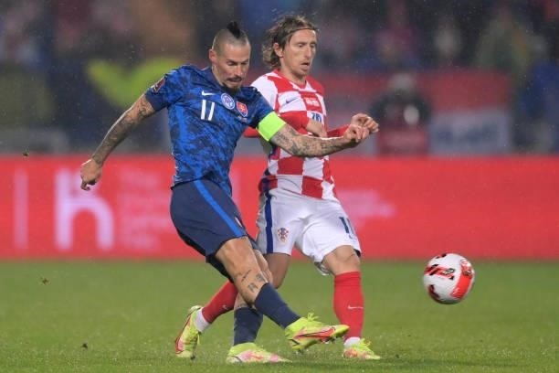 Marek Hamsik of Slovakia in action against Luka Modric of Croatia during the 2022 FIFA World Cup Group H Qualifier match between Croatia and Slovakia...