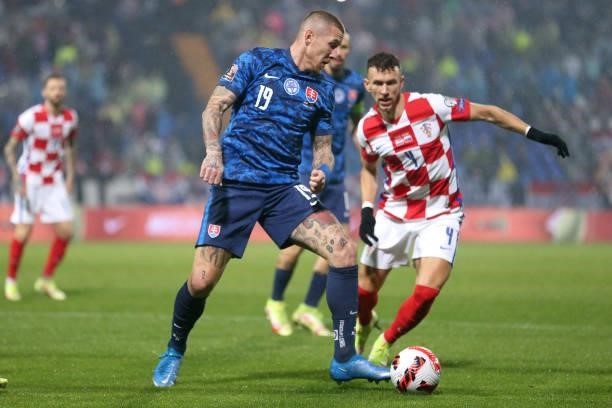 Juraj Kucka of Slovakia in action against Ivan Perisic of Croatia during the 2022 FIFA World Cup Group H Qualifier match between Croatia and Slovakia...